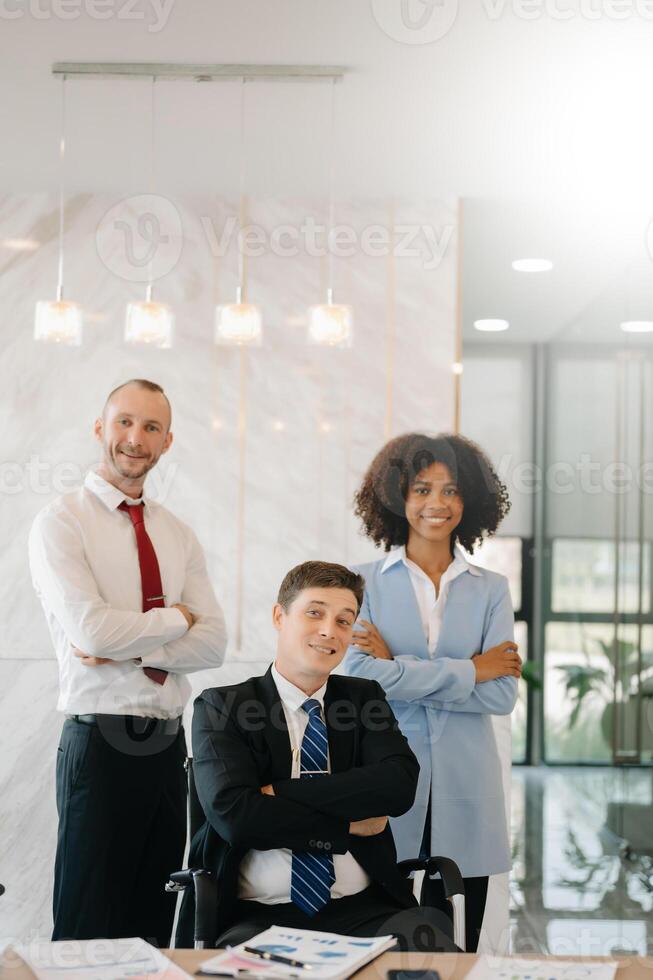 Business partners sitting at officeand smiling at camera. Executives  successful business team photo