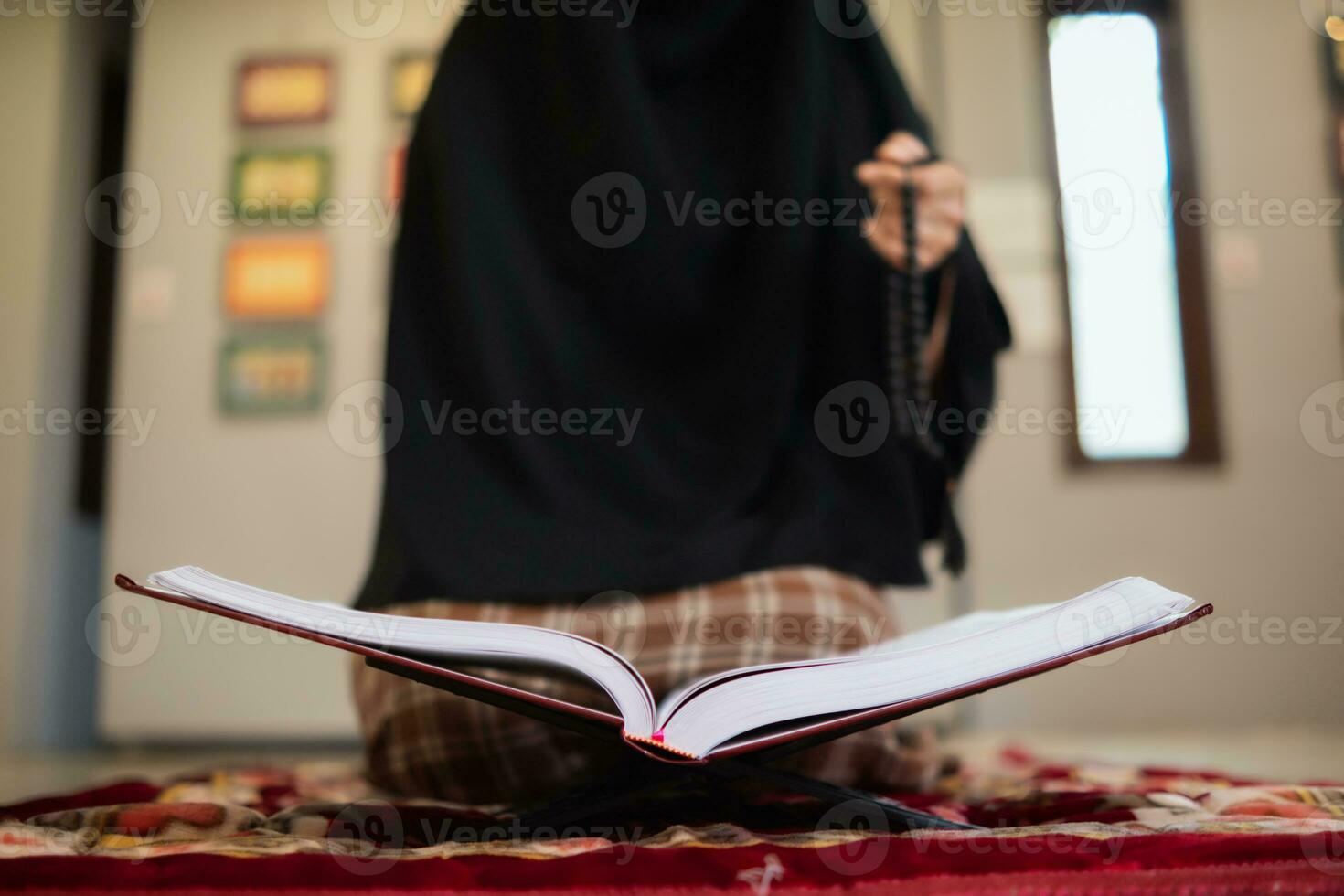 muslim women in hijab are praying to show respect and thanks to allah according to muslim belief and muslim women in hijab are praying to allah according to traditional belief from quran photo