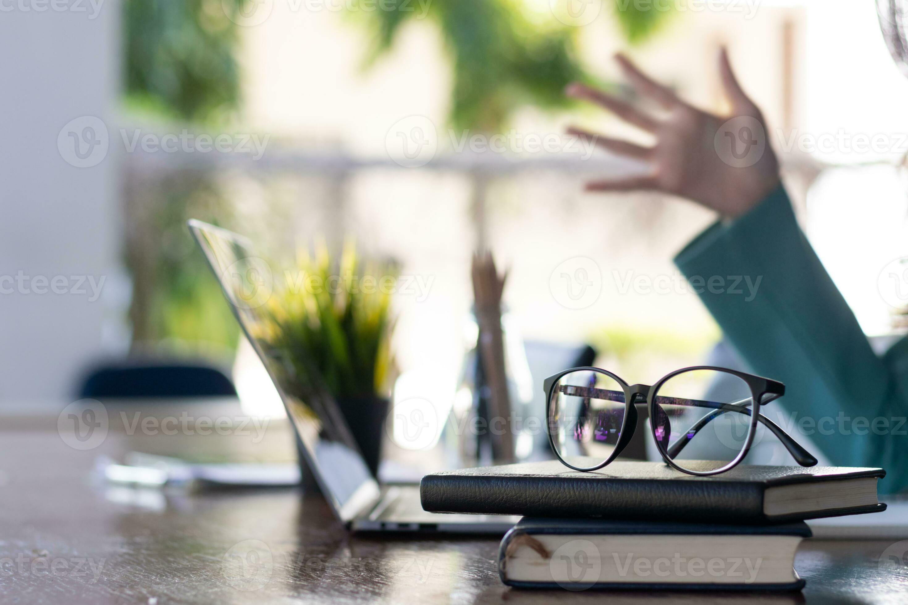 eye glasses placed on the desk are eye glasses that are prepared for