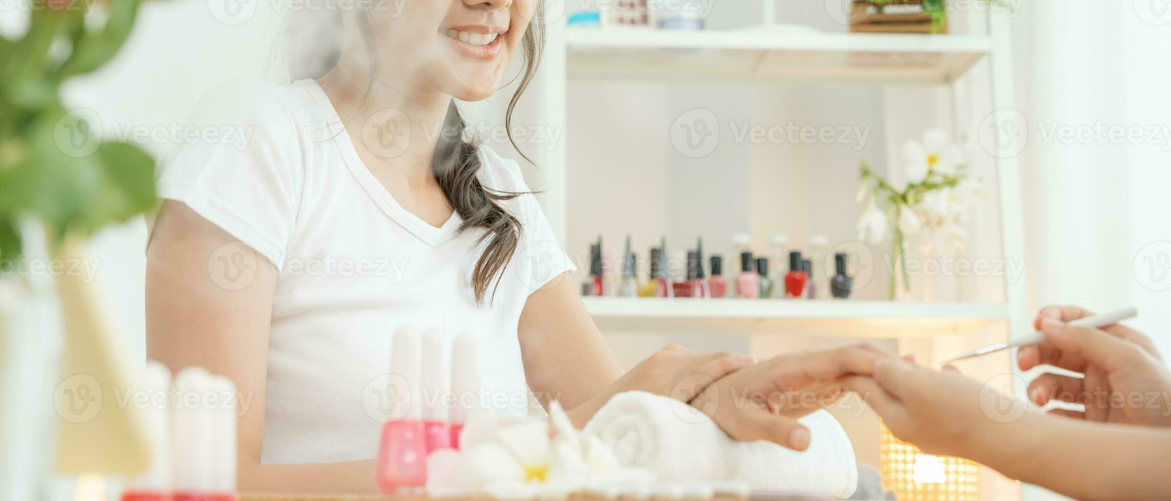 Woman receive care service by professional Beautician Manicure at spa centre. Nail beauty salon use nail file for Glazing treatment. manicurist make nail customer to beautiful. body care spa treatment photo