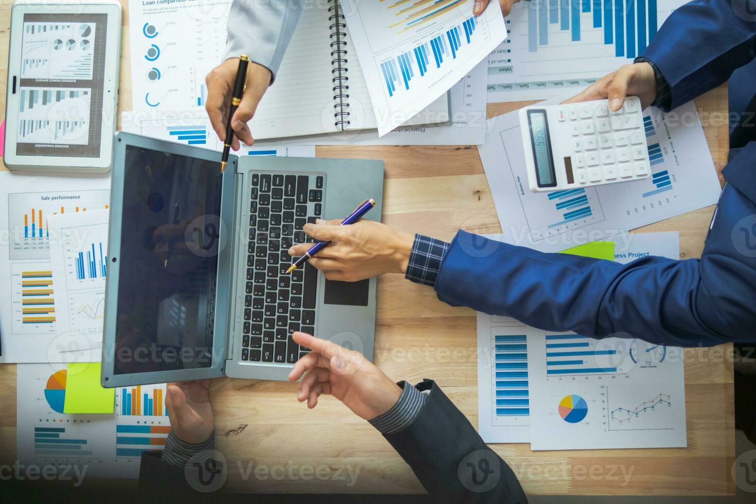 A group of businesspeople and investors meet to discuss market's success in past quarter. idea of setting up a marketing consulting team and working together as a team made it a success. photo