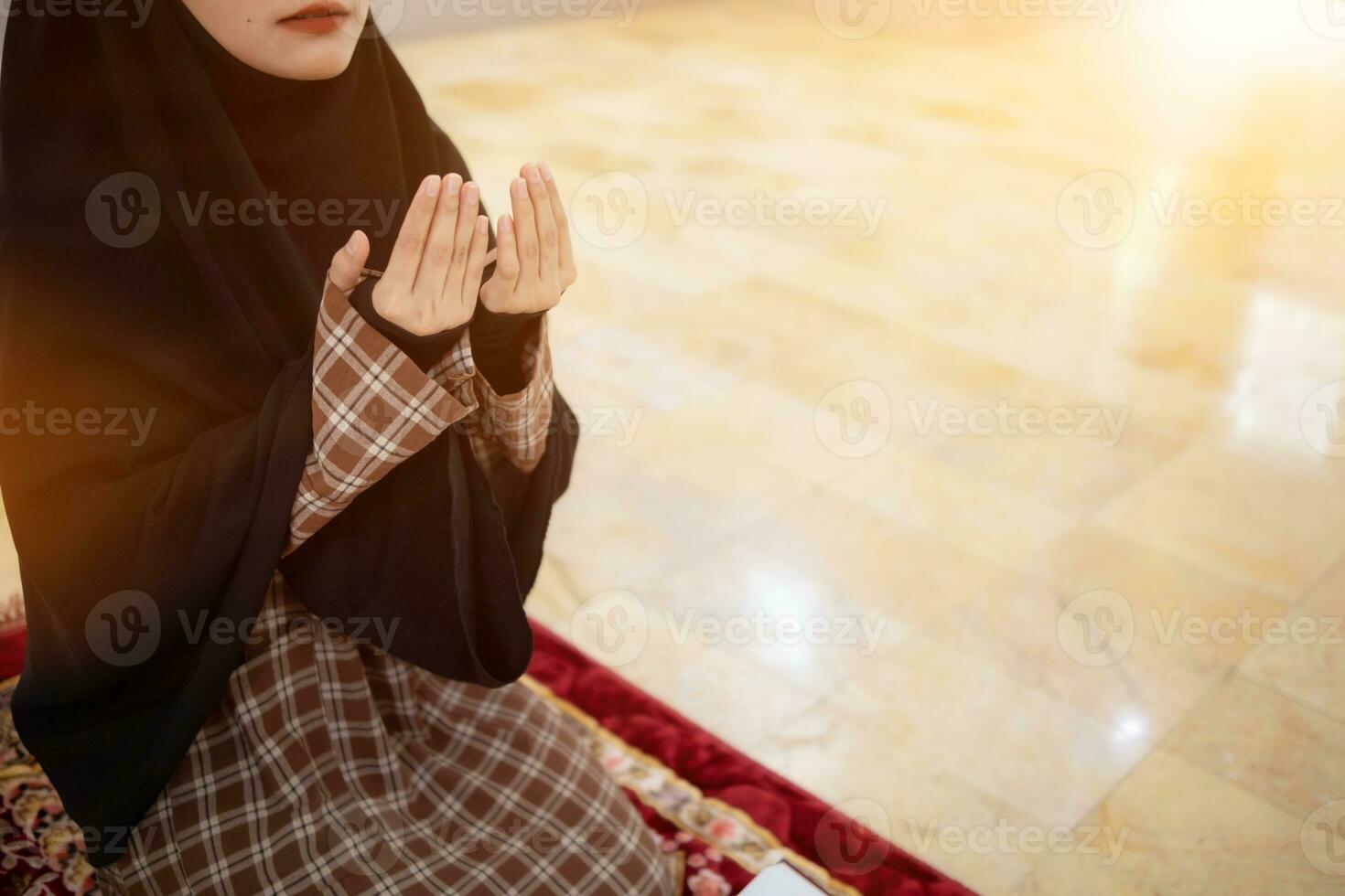 muslim women in hijab are praying to show respect and thanks to allah according to muslim belief and muslim women in hijab are praying to allah according to traditional belief from quran photo