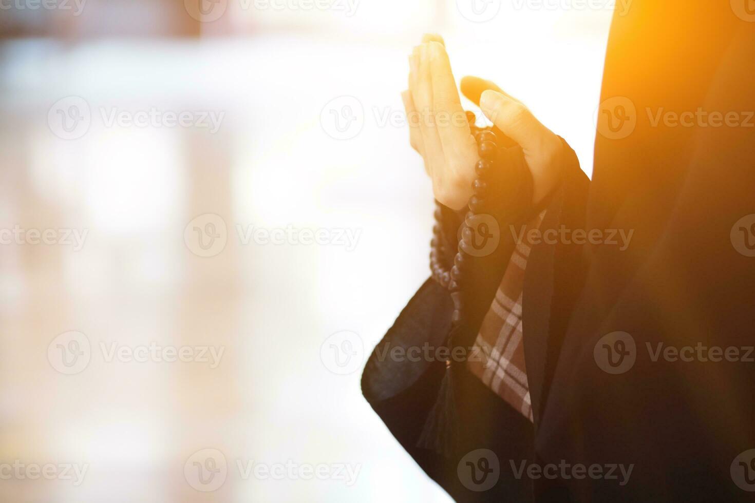 muslim women in hijab are praying to show respect and thanks to allah according to muslim belief and muslim women in hijab are praying to allah according to traditional belief from quran photo