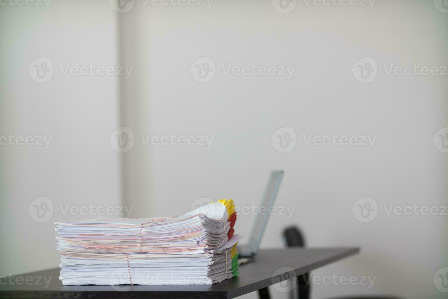 piles of documents are arranged in order to make them easier to find and piles of documents are also gathered before being stored in filing room. Organized piles of documents and copy space for text photo