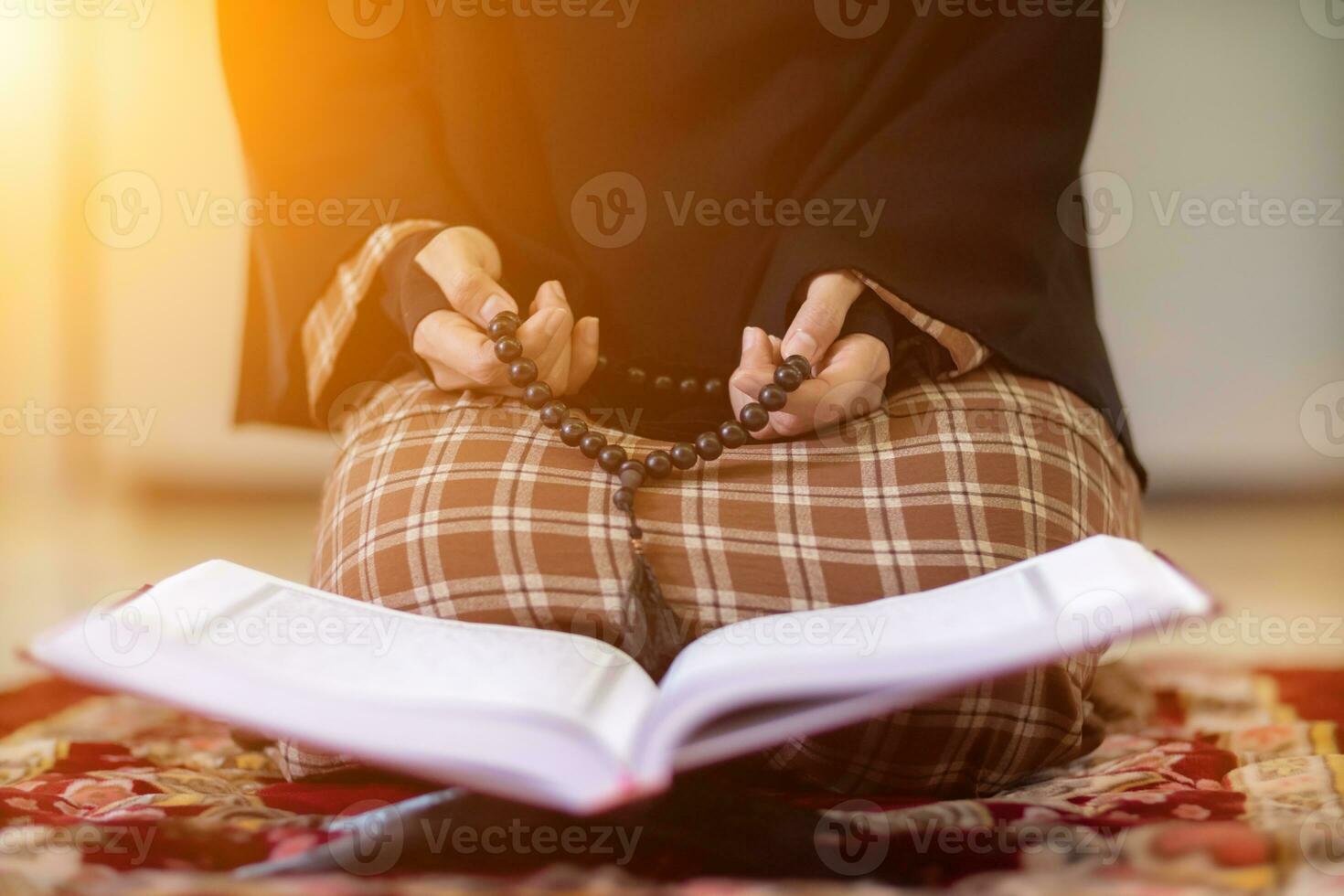 muslim women in hijab are praying to show respect and thanks to allah according to muslim belief and muslim women in hijab are praying to allah according to traditional belief from quran photo
