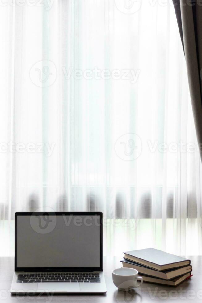 Notebook computers are geared up for online work because it's when companies allow working from home. The concept of working from home with Notebook via online system. Copy space for text photo