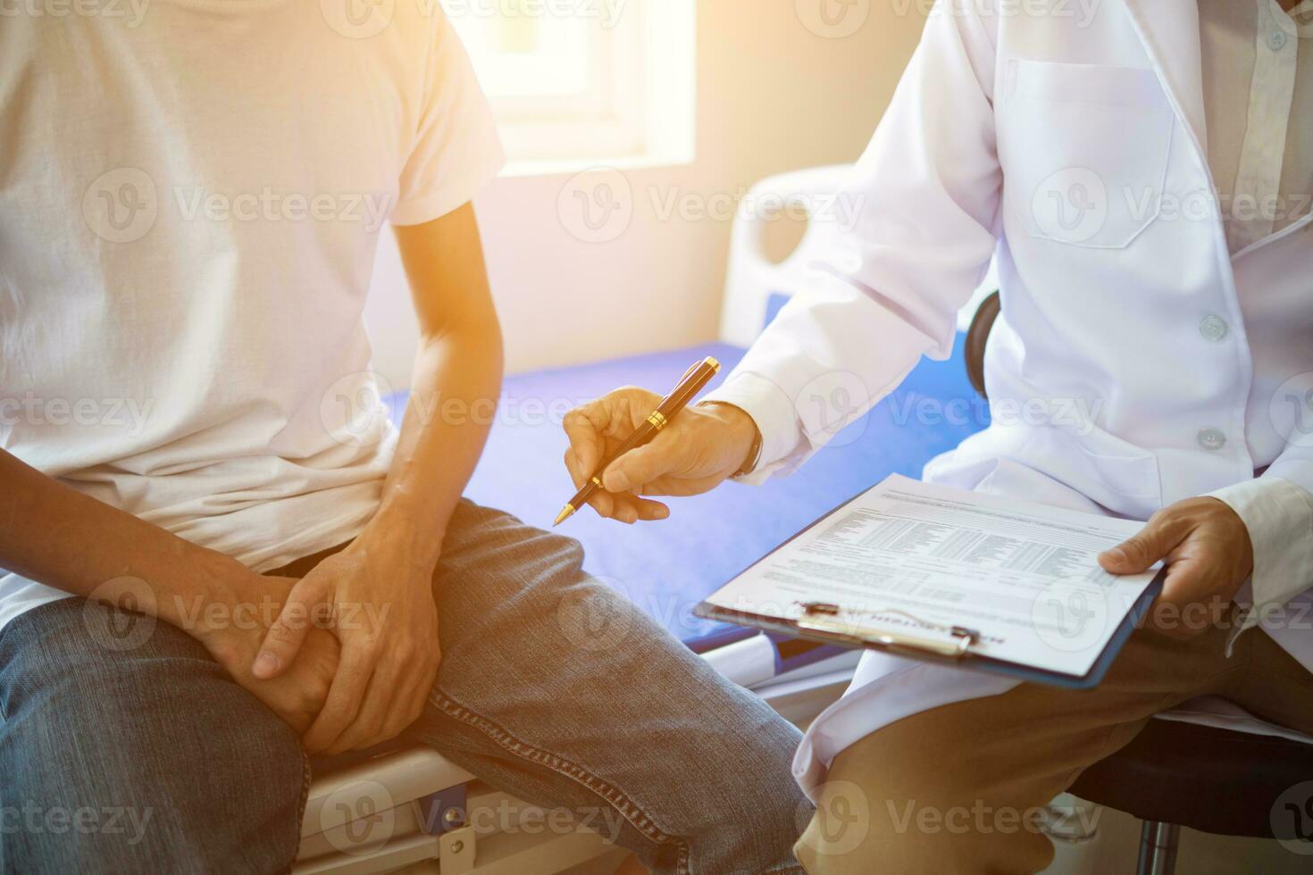 doctor is having consultation discussing prostate cancer and venereal cancer detected in young man. Current doctors provide advice and counseling on detecting prostate cancer and treating it properly. photo