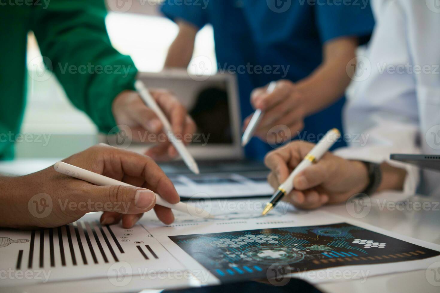 concept of mobilizing ability of medical team in conference room to diagnose and treat disease correctly. medical team joins meeting and discusses  patient illness in order to treat it correctly photo