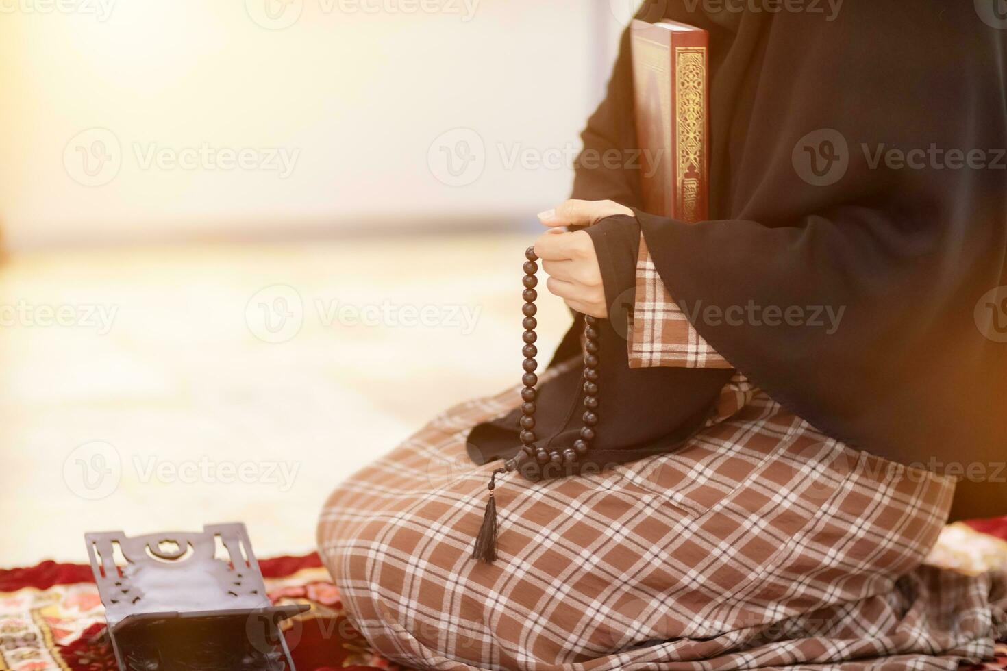 muslim women in hijab are praying to show respect and thanks to allah according to muslim belief and muslim women in hijab are praying to allah according to traditional belief from quran photo