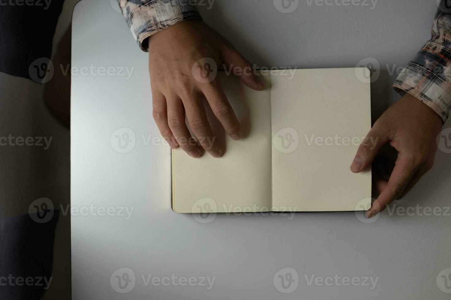 young man was praying to God in front of Bible with faith and power of faith in God. Bible study concept to understand and pray to God with faith in teachings of the Bible studied. Copy Space photo