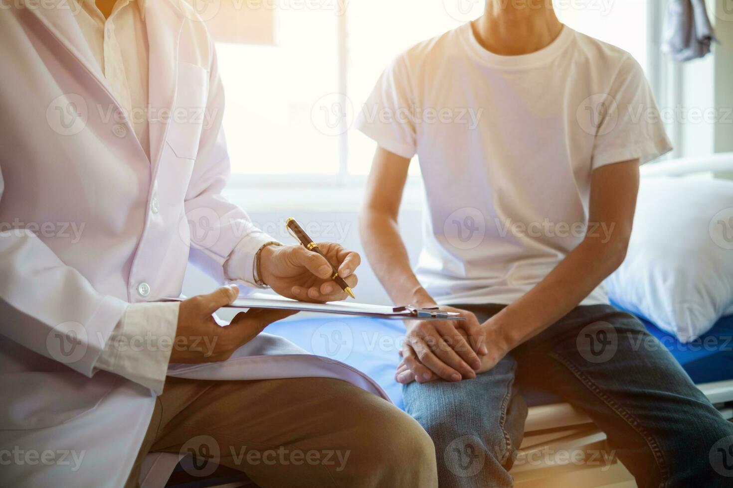 doctor is having consultation discussing prostate cancer and venereal cancer detected in young man. Current doctors provide advice and counseling on detecting prostate cancer and treating it properly. photo