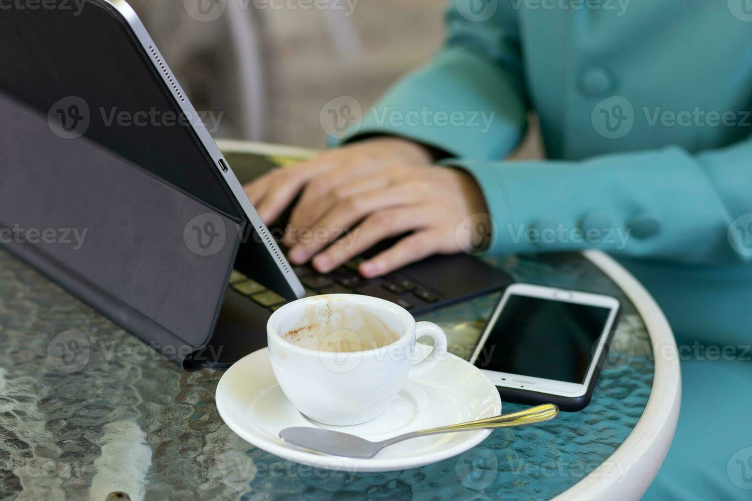 Young women work from home and use laptop computers to search for information and communicate with colleagues to work online. The concept of working from home with Notebook via online system. photo