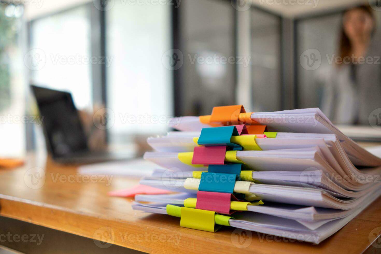 A huge stacked documents is an annual earnings summary document prepared for business people to use in attending meetings and this stacked paper is also an important document. photo