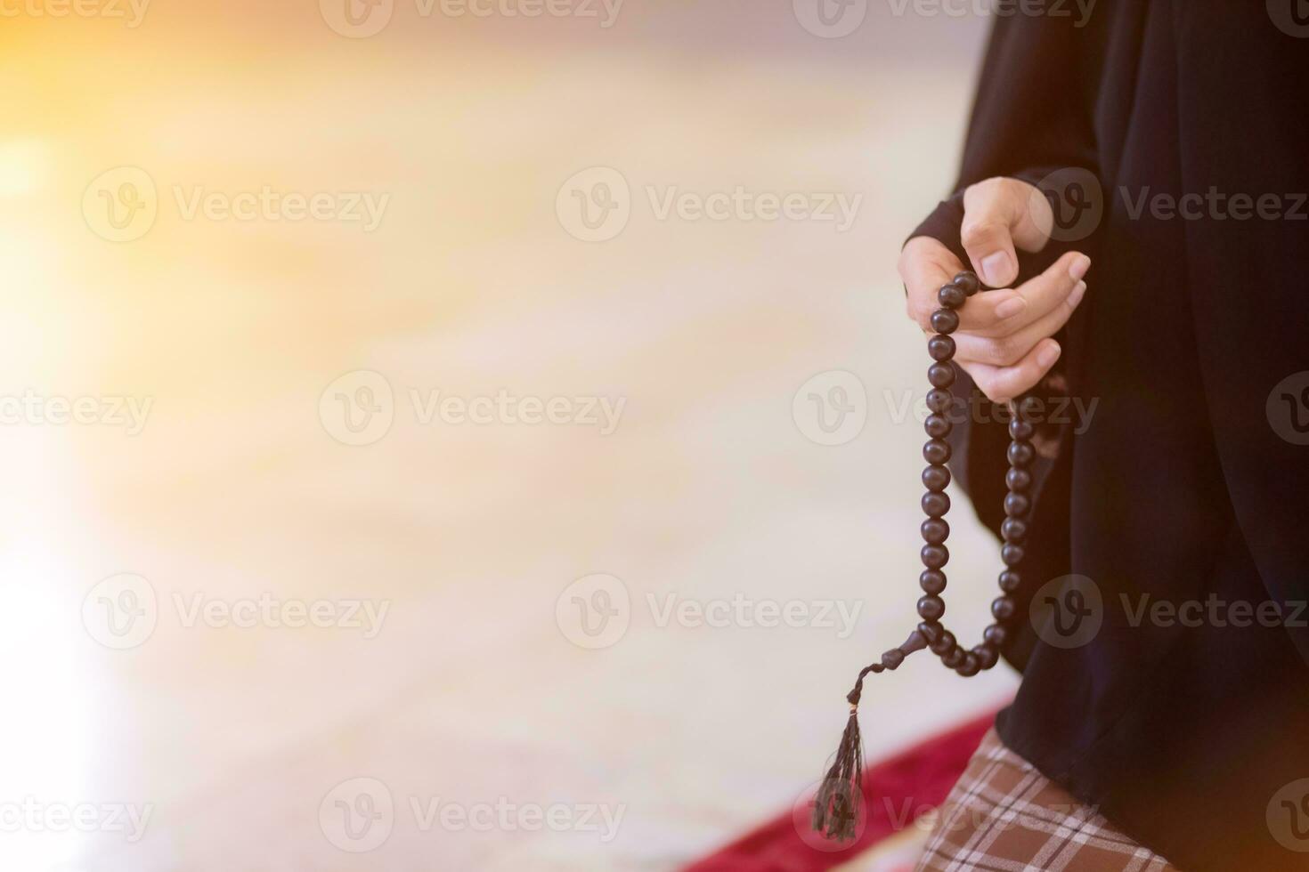 muslim women in hijab are praying to show respect and thanks to allah according to muslim belief and muslim women in hijab are praying to allah according to traditional belief from quran photo