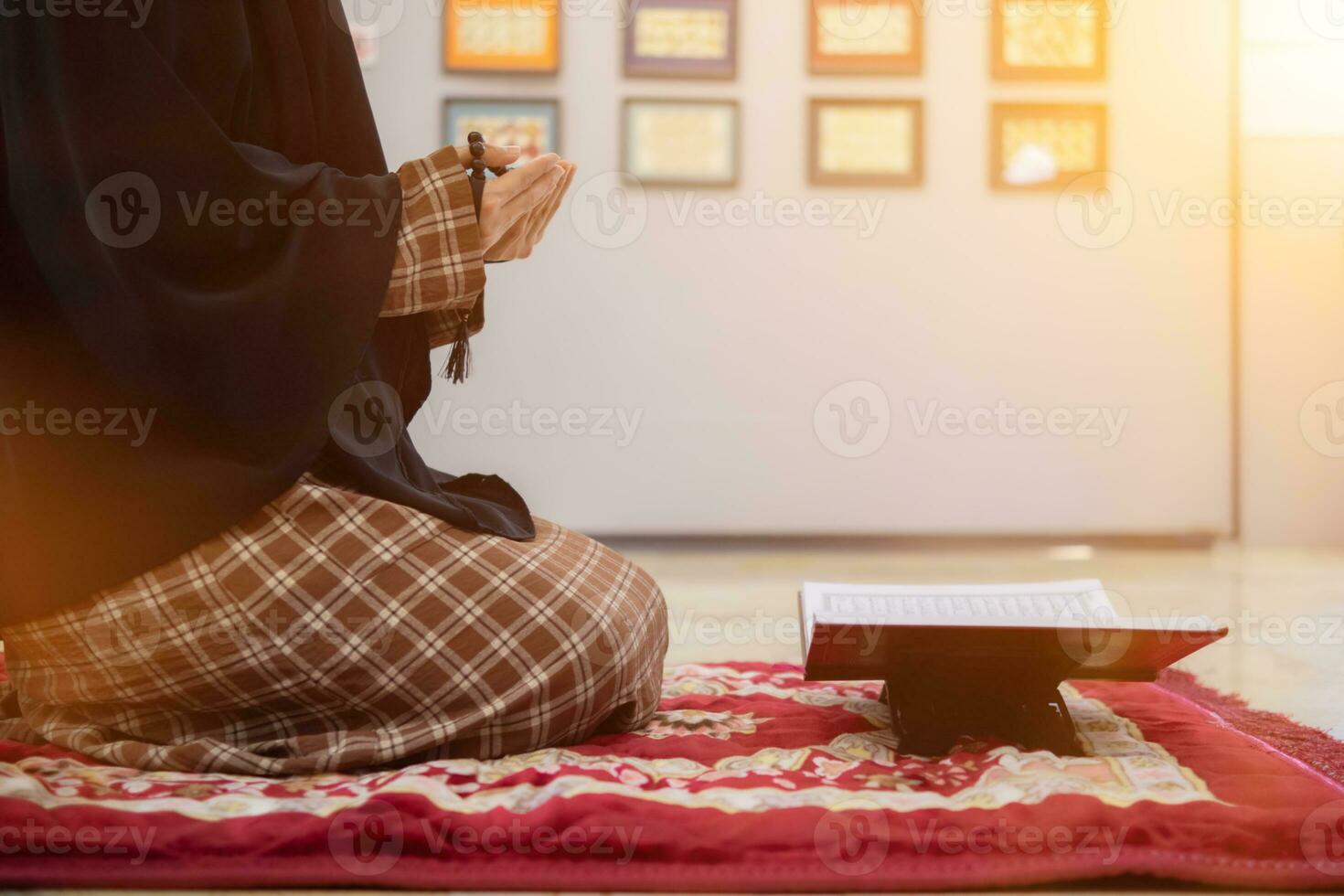 muslim women in hijab are praying to show respect and thanks to allah according to muslim belief and muslim women in hijab are praying to allah according to traditional belief from quran photo