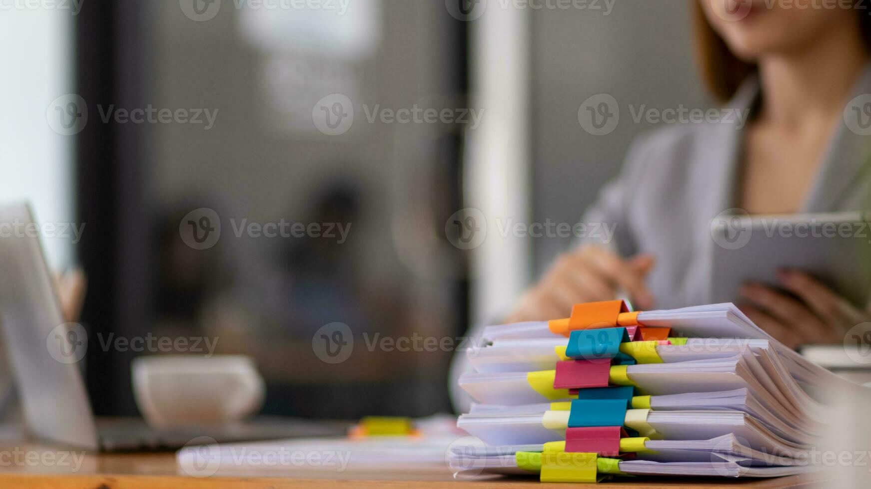 A huge stacked documents is an annual earnings summary document prepared for business people to use in attending meetings and this stacked paper is also an important document. photo