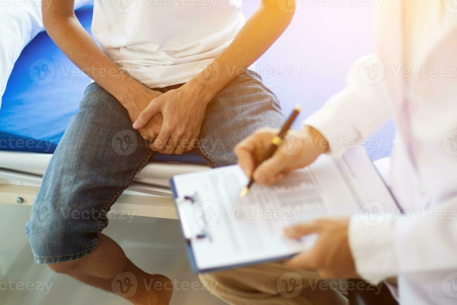 doctor is having consultation discussing prostate cancer and venereal cancer detected in young man. Current doctors provide advice and counseling on detecting prostate cancer and treating it properly. photo