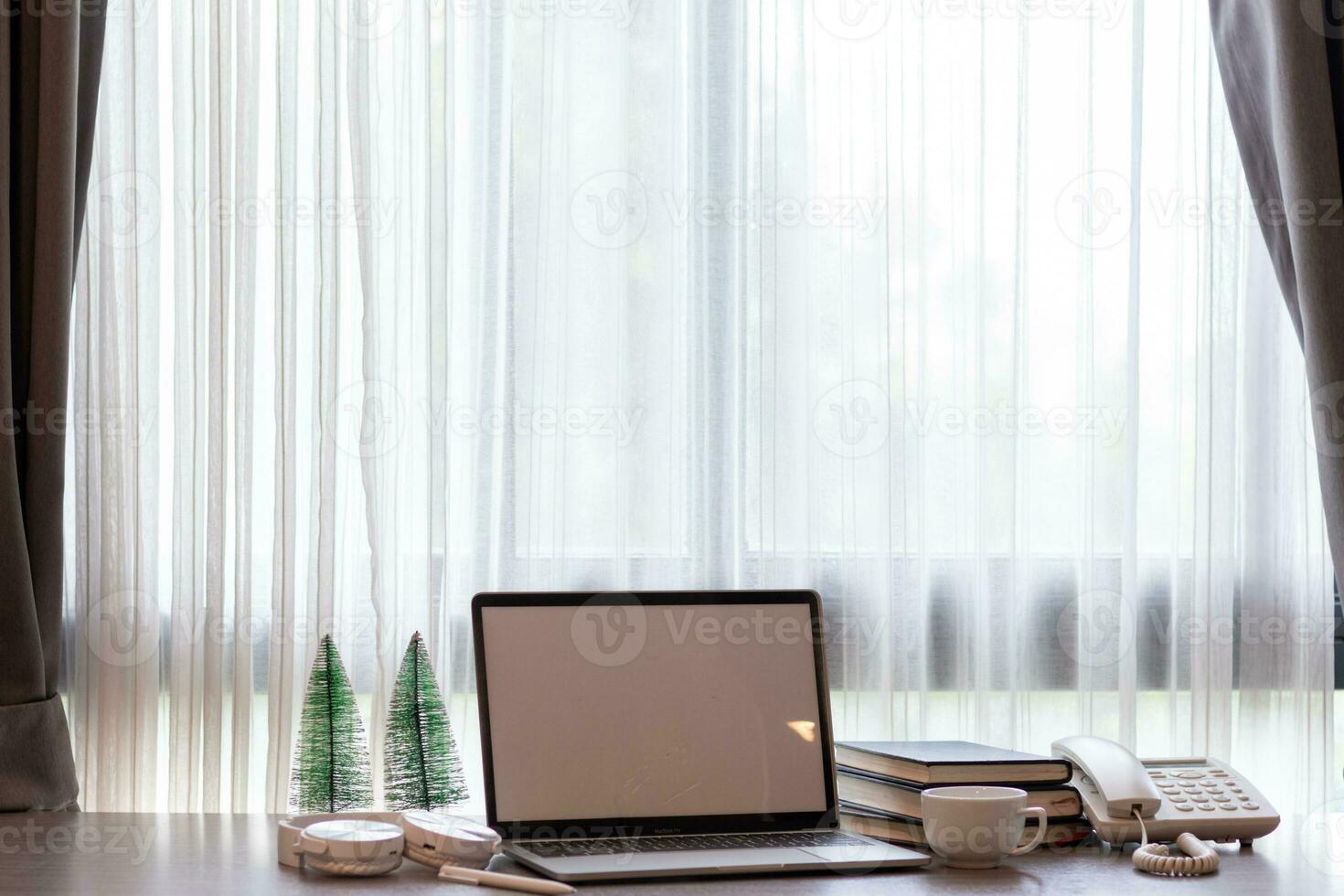 Notebook computers are geared up for online work because it's when companies allow working from home. The concept of working from home with Notebook via online system. Copy space for text photo