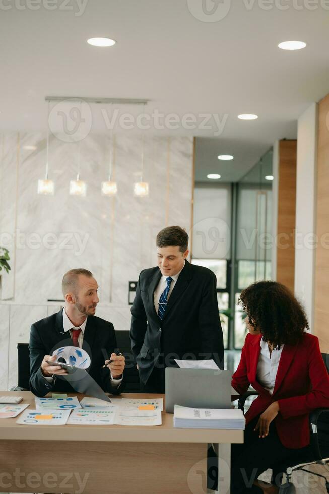 Young business creative team are brainstorming planning discussing while sitting in creative business discussing work in the office photo