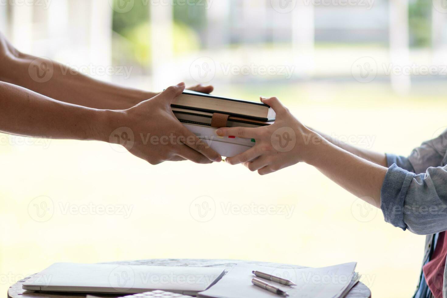 Young woman holding law book in her hand to review and understand law before taking exam to become lawyer. concept of reading books to understand and learn law before taking exam to become lawyer. photo