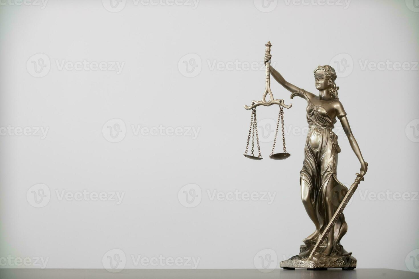 statue of god Themis Lady Justice is used as symbol of justice within law firm to demonstrate truthfulness of  facts and power to judge without prejudice. Themis Lady Justice is of justice. photo