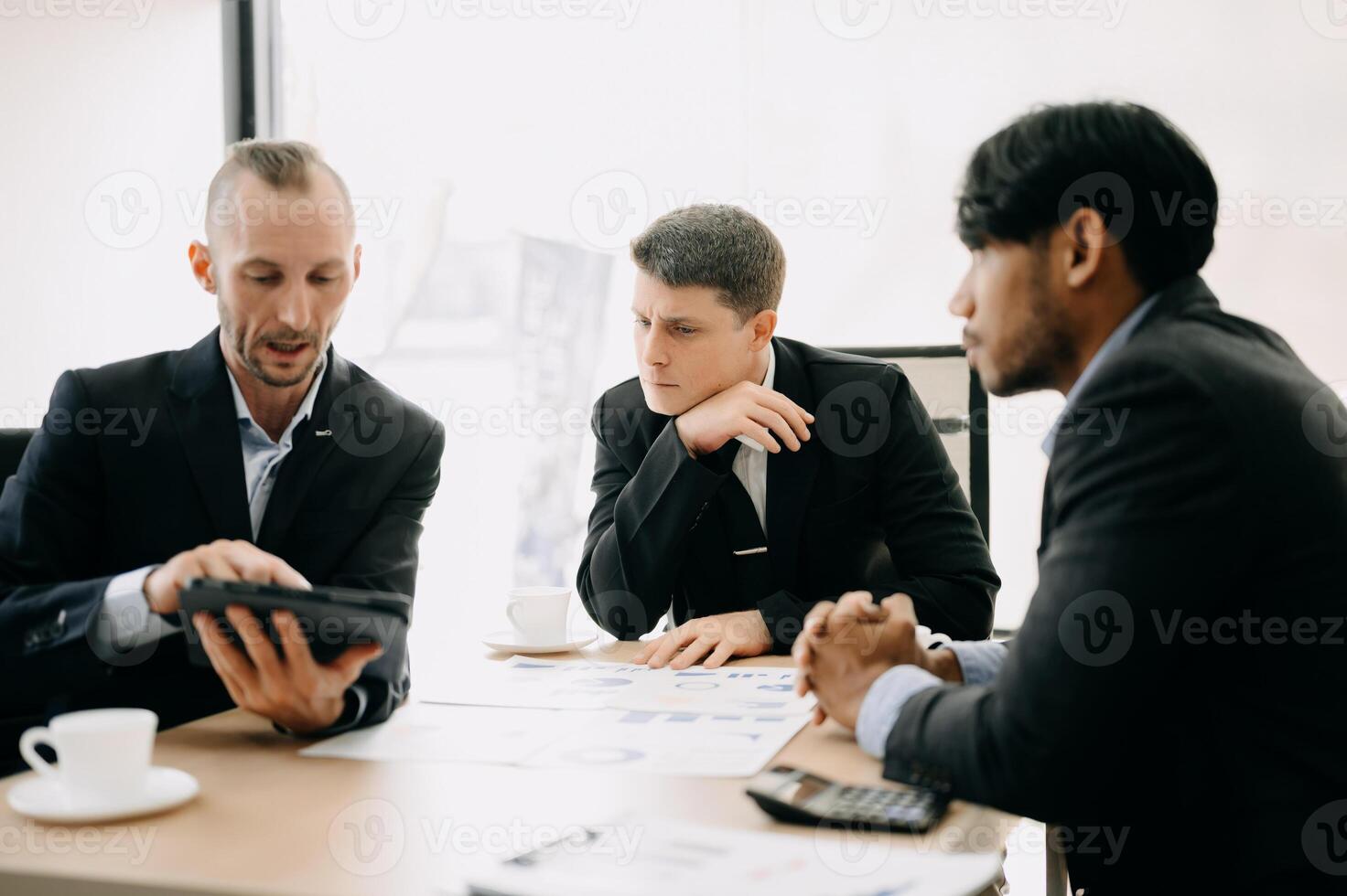 Business team discuss at meeting room. working together with laptop ,tablet and smart phone on desk Financial accountant , planner , meeting , introduction concept. At office photo
