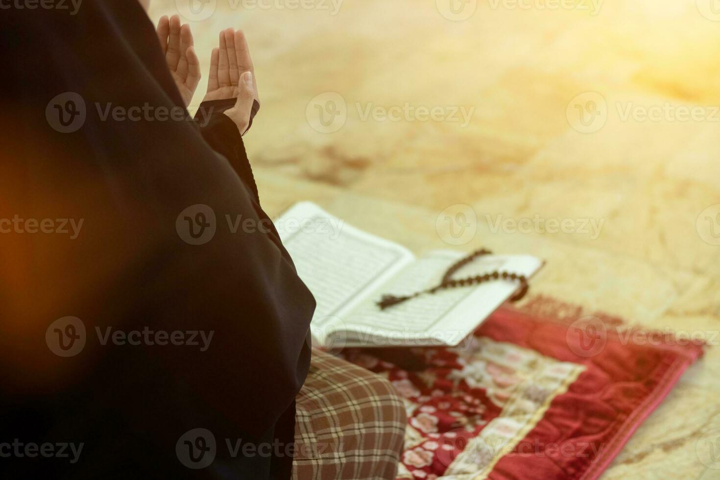 muslim women in hijab are praying to show respect and thanks to allah according to muslim belief and muslim women in hijab are praying to allah according to traditional belief from quran photo