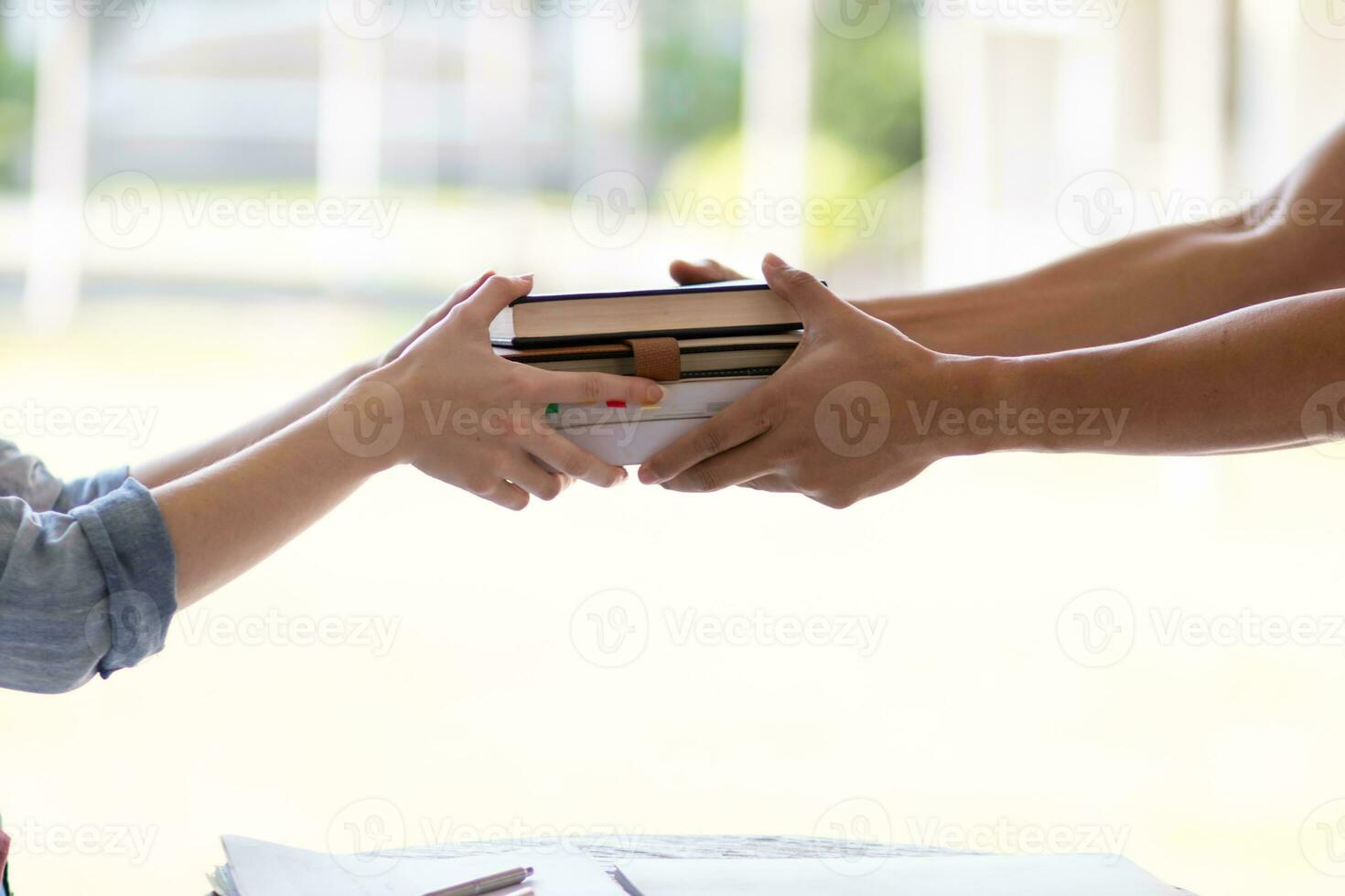 Young woman holding law book in her hand to review and understand law before taking exam to become lawyer. concept of reading books to understand and learn law before taking exam to become lawyer. photo