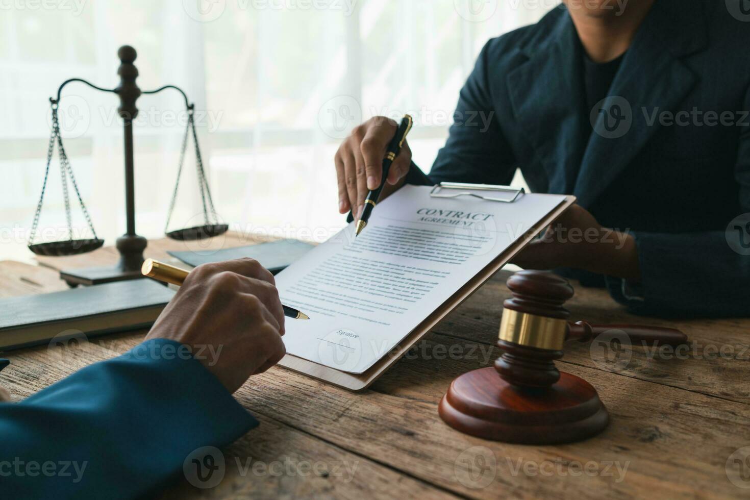 contract of sale was placed on the table in the lawyer office because the company hired the lawyer office as a legal advisor and drafted the contract so that the client could sign the right contract. photo