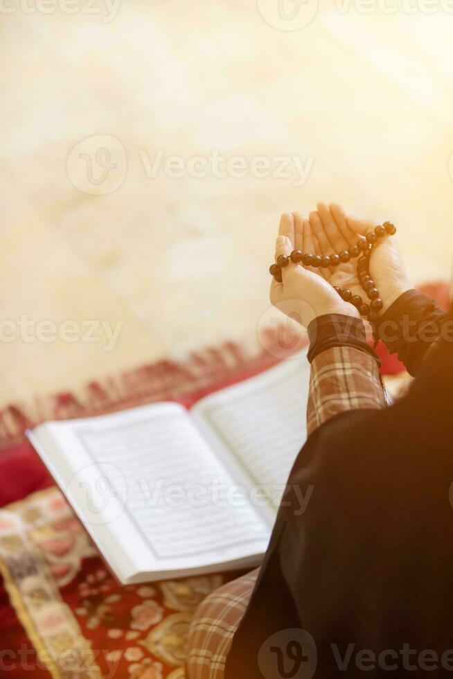 muslim women in hijab are praying to show respect and thanks to allah according to muslim belief and muslim women in hijab are praying to allah according to traditional belief from quran photo
