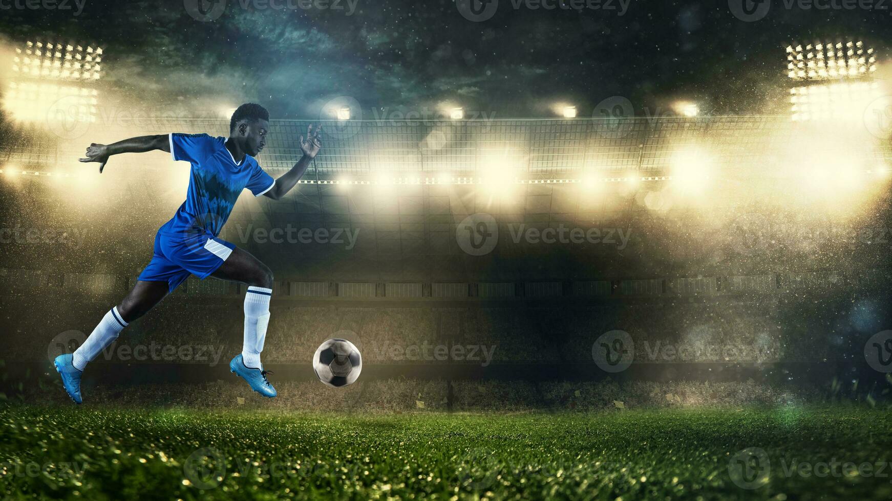 Soccer player in blue uniform sprinting fast with the ball at the stadium photo