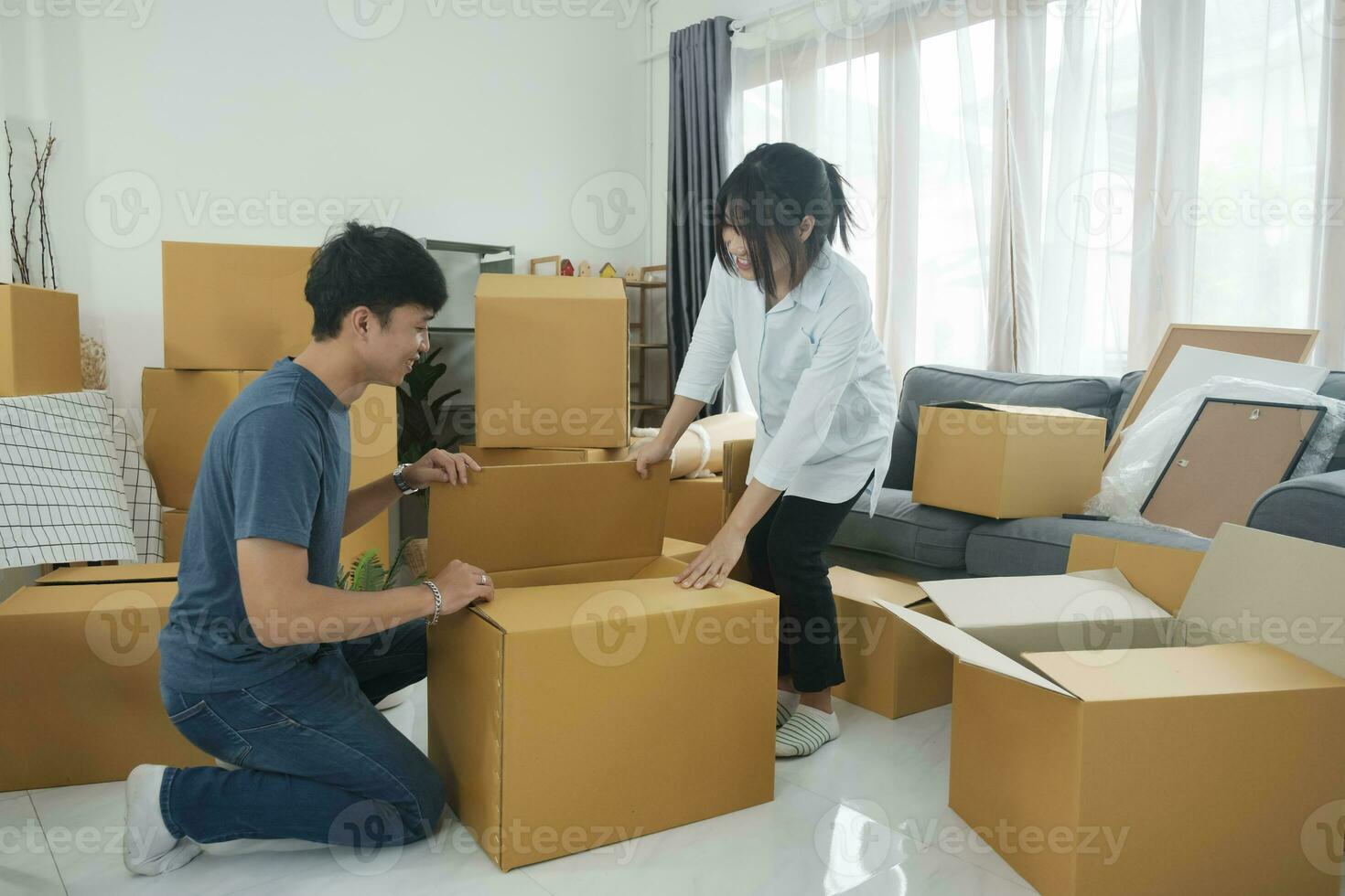 Asian young happy new married couple moving to their new house or real estate. photo