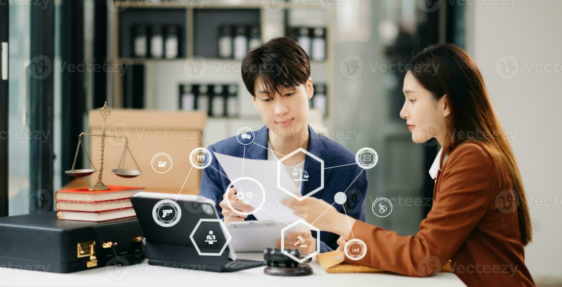 Asian business people and lawyers discussing contract papers sitting at the table. Concepts of law, advice, legal services. with VR icon photo