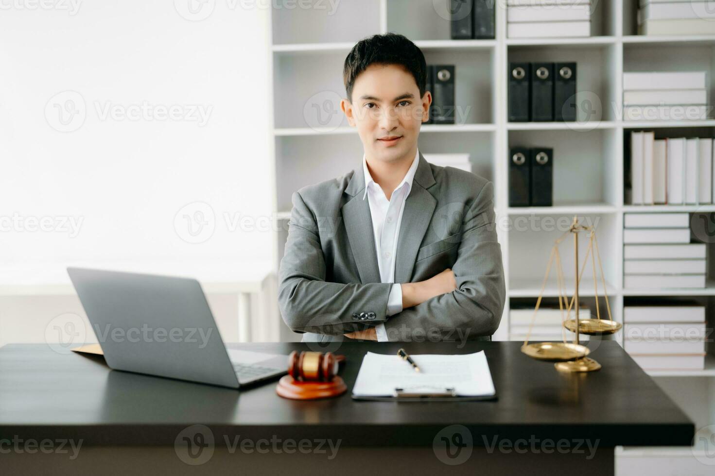 justice and law concept .Asian Male judge in a courtroom on table and Counselor working in office. photo