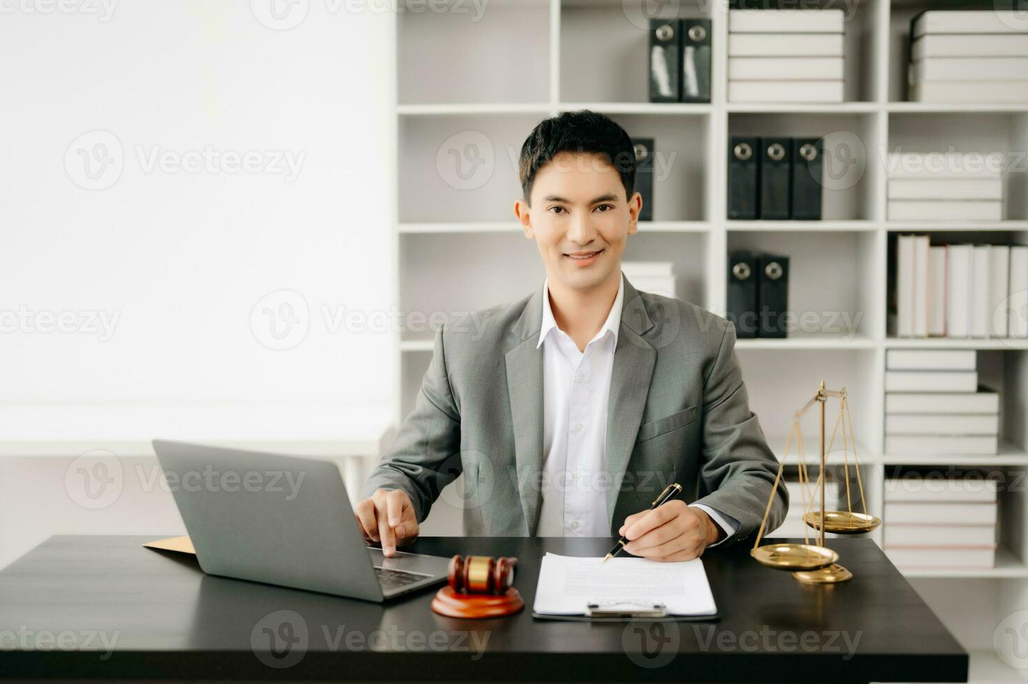 justice and law concept .Asian Male judge in a courtroom on table and Counselor working in office. photo