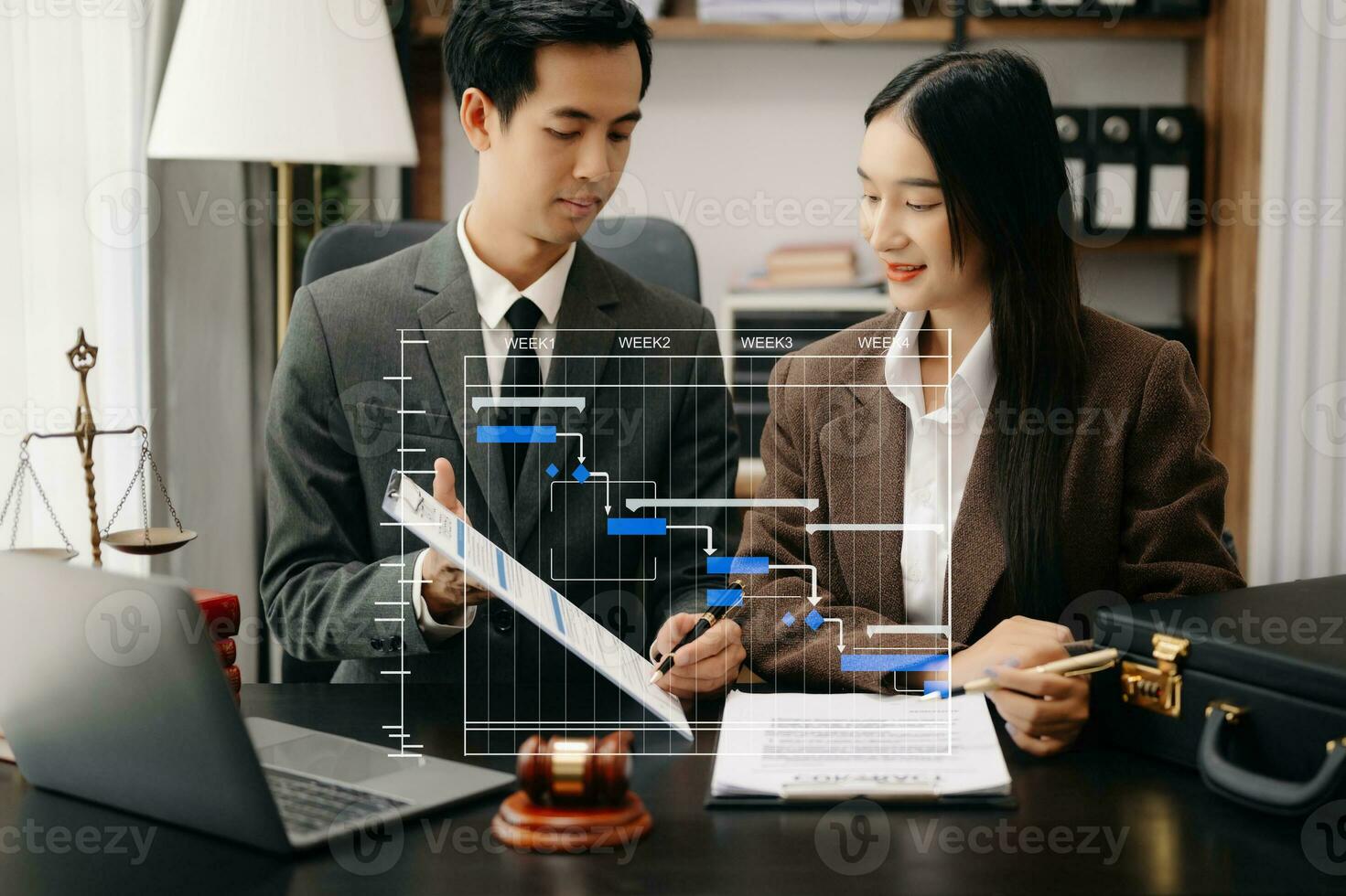 Business and lawyers discussing contract papers with brass scale on desk in office. Law, legal services, advice,  justice and law concept . photo