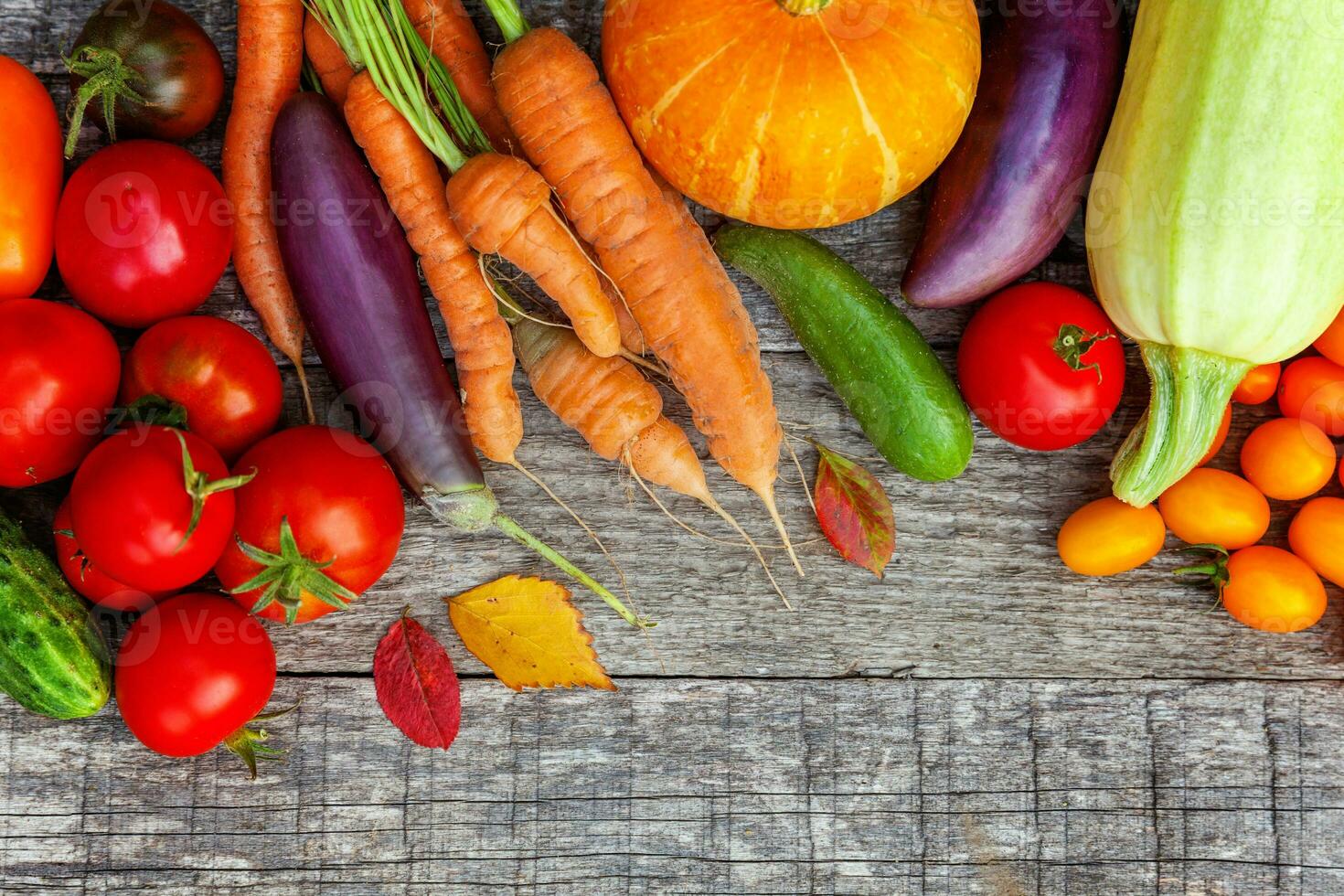 Assortment different fresh organic vegetables on country style wooden background. Healthy food vegan vegetarian dieting concept. Local garden produce clean food. Frame top view flat lay copy space. photo