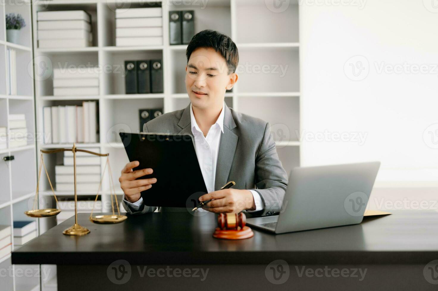 justice and law concept .Asian Male judge in a courtroom on table and Counselor working in office. photo