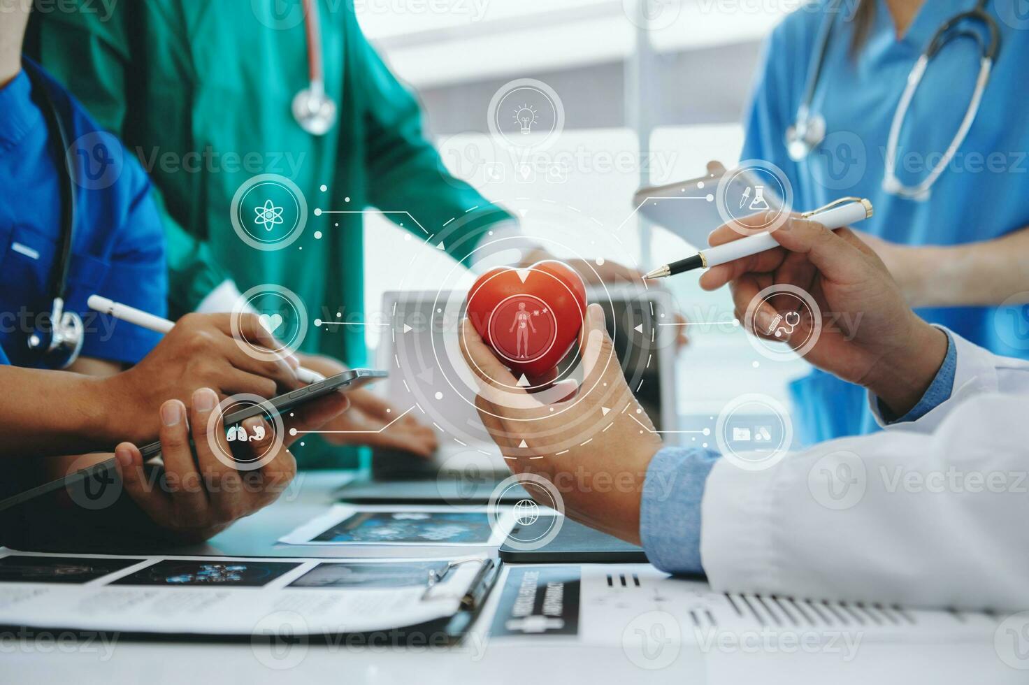 Medical technology network team meeting concept. Doctor hand working with smart phone modern digital tablet and laptop computer with graphics chart interface, with virtual icon diagram photo