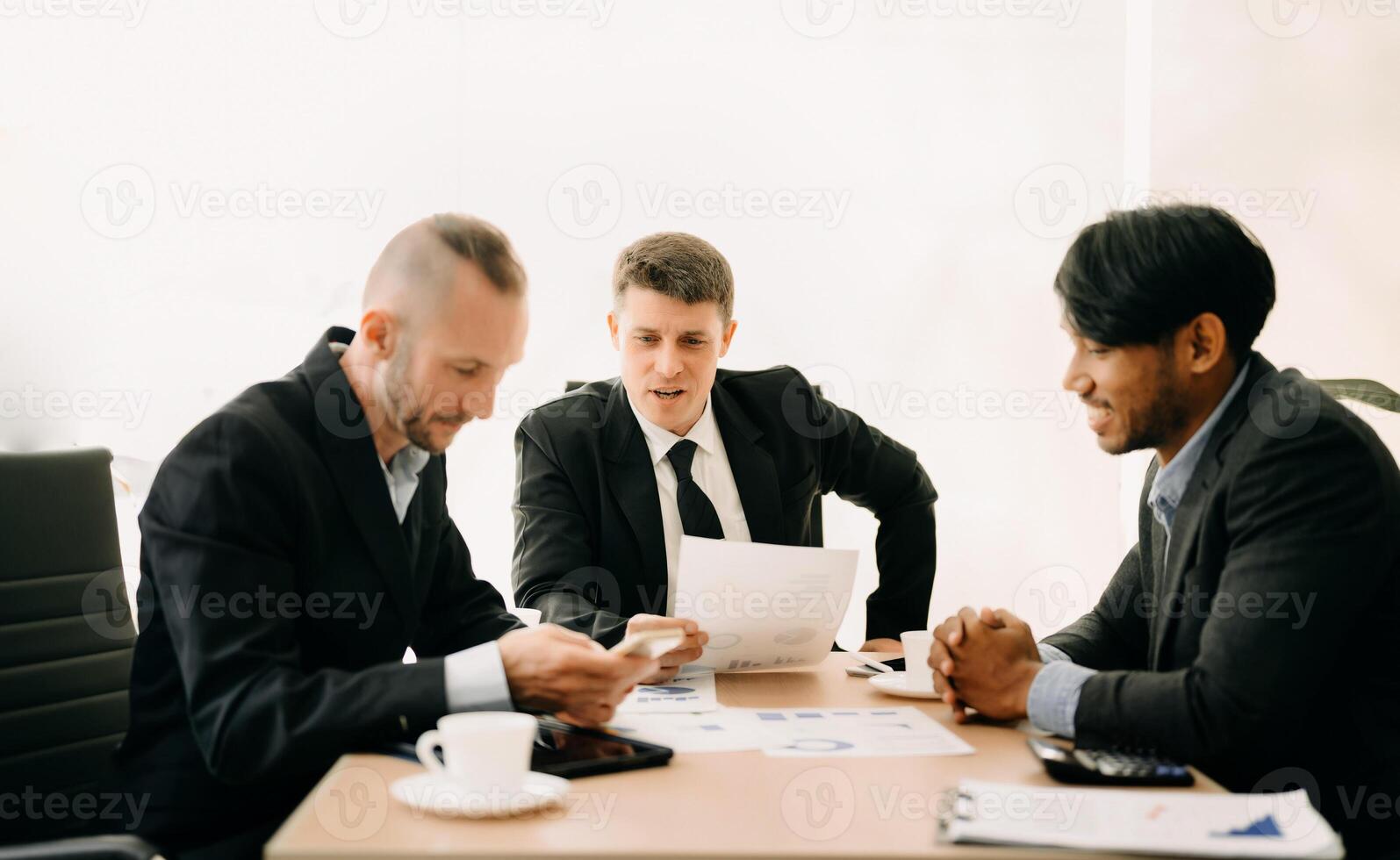 Business team discuss at meeting room. working together with laptop ,tablet and smart phone on desk Financial accountant , planner , meeting , introduction concept. At office photo
