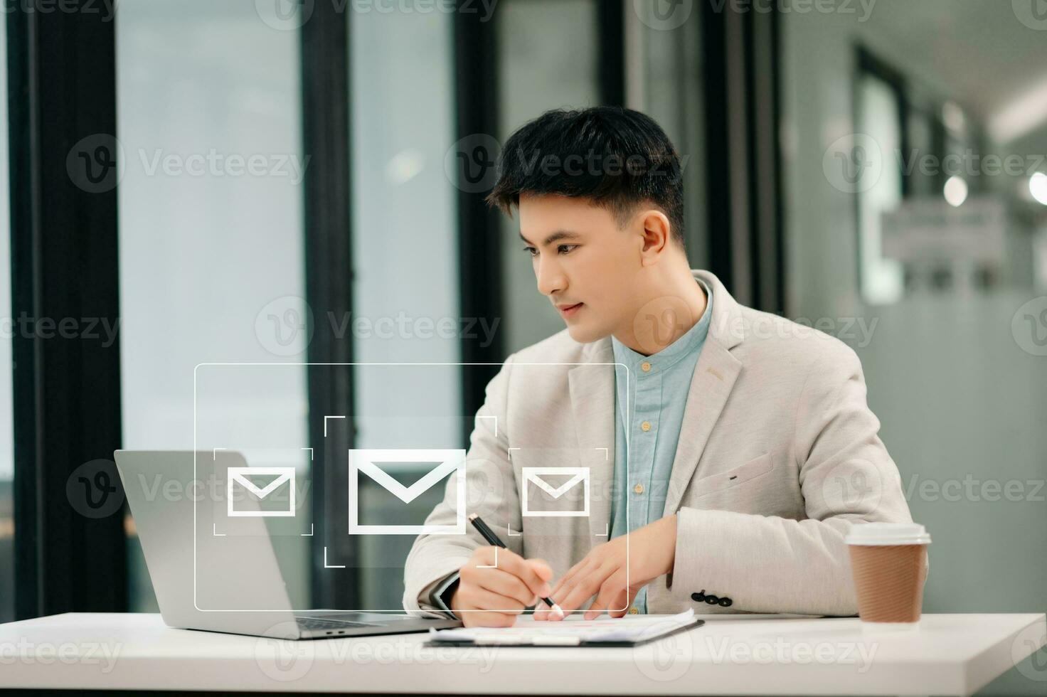 Asian man hands using Laptop, tablet typing on keyboard and surfing the internet with email icon, email marketing concept, send e-mail or newsletter, online working internet network technology. photo