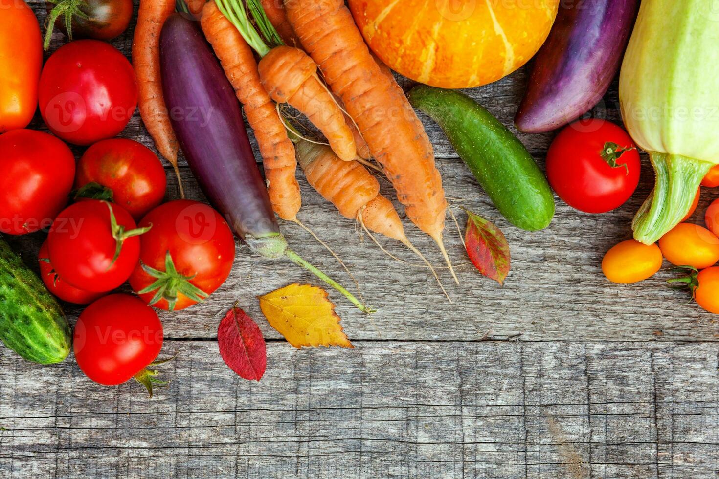 Assortment different fresh organic vegetables on country style wooden background. Healthy food vegan vegetarian dieting concept. Local garden produce clean food. Frame top view flat lay copy space. photo