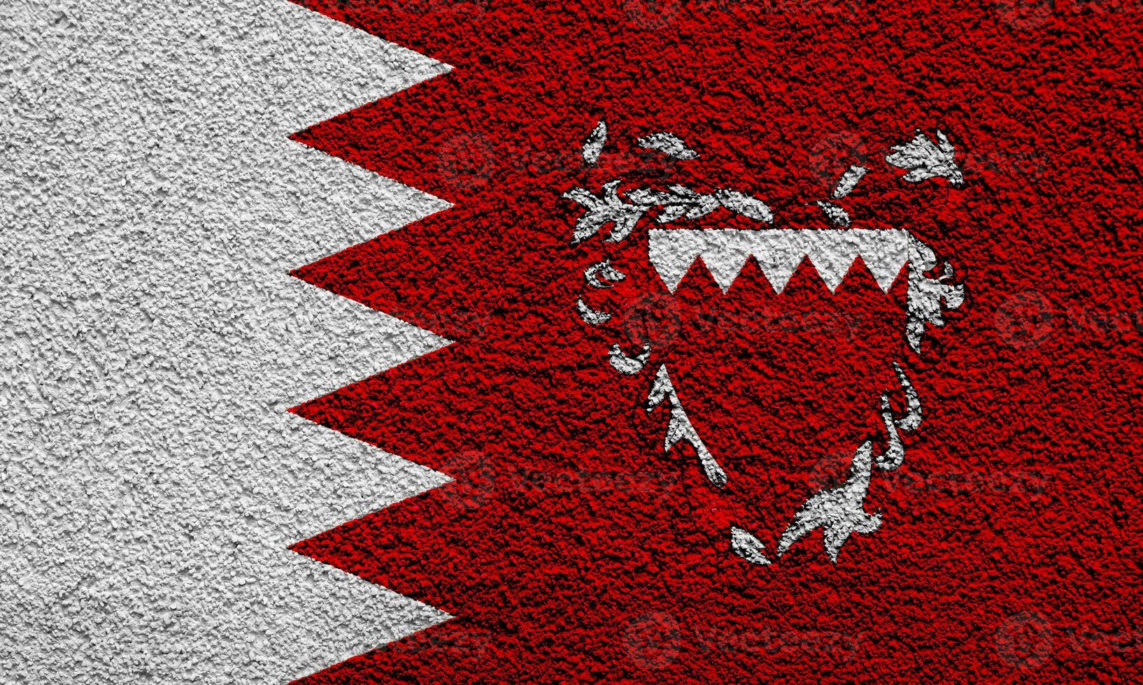 Flag and coat of arms of Kingdom of Bahrain on a textured background. Concept collage. photo