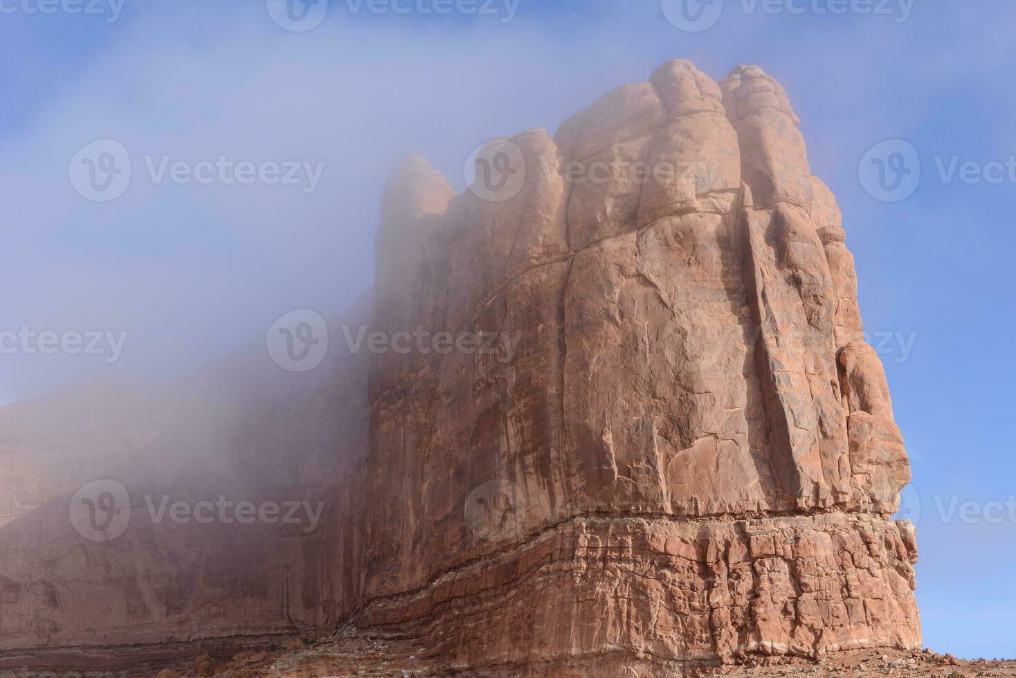 sandstone rock in the mist photo