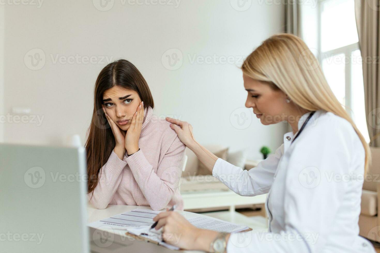 Patient receiving bad news, She is desperate and crying, Doctor support and comforting her patient with sympathy. Don't worry, this medical test is not so bad photo