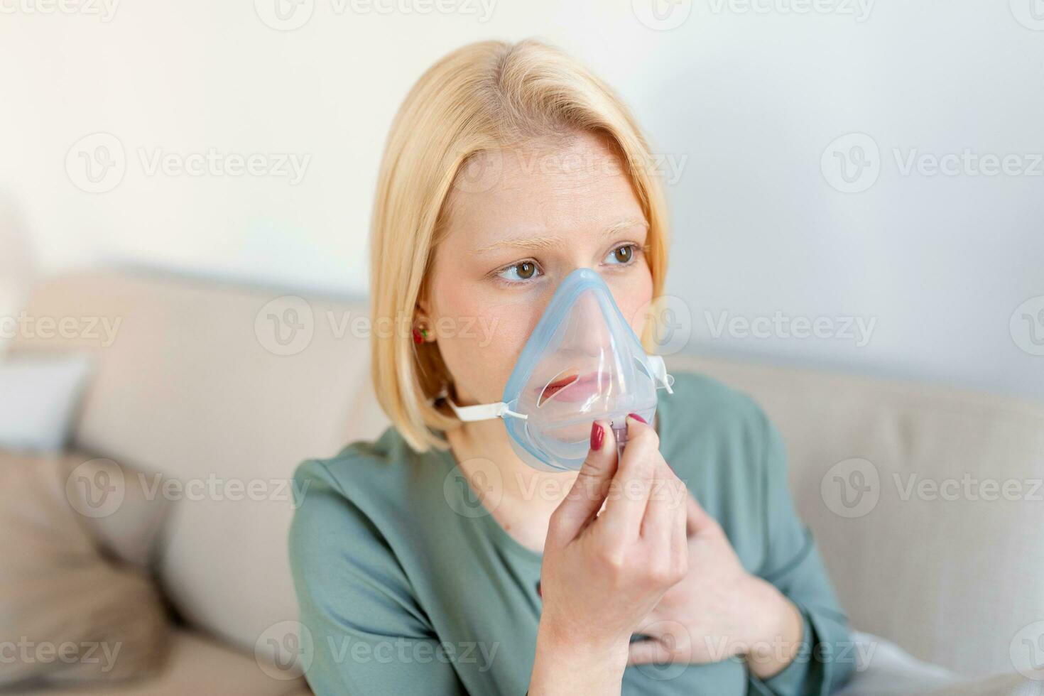 Sick woman on oxygen mask inhalation, pneumonia coronavirus pandemic. ill woman wearing an oxygen mask and undergoing treatment. covid 19 photo