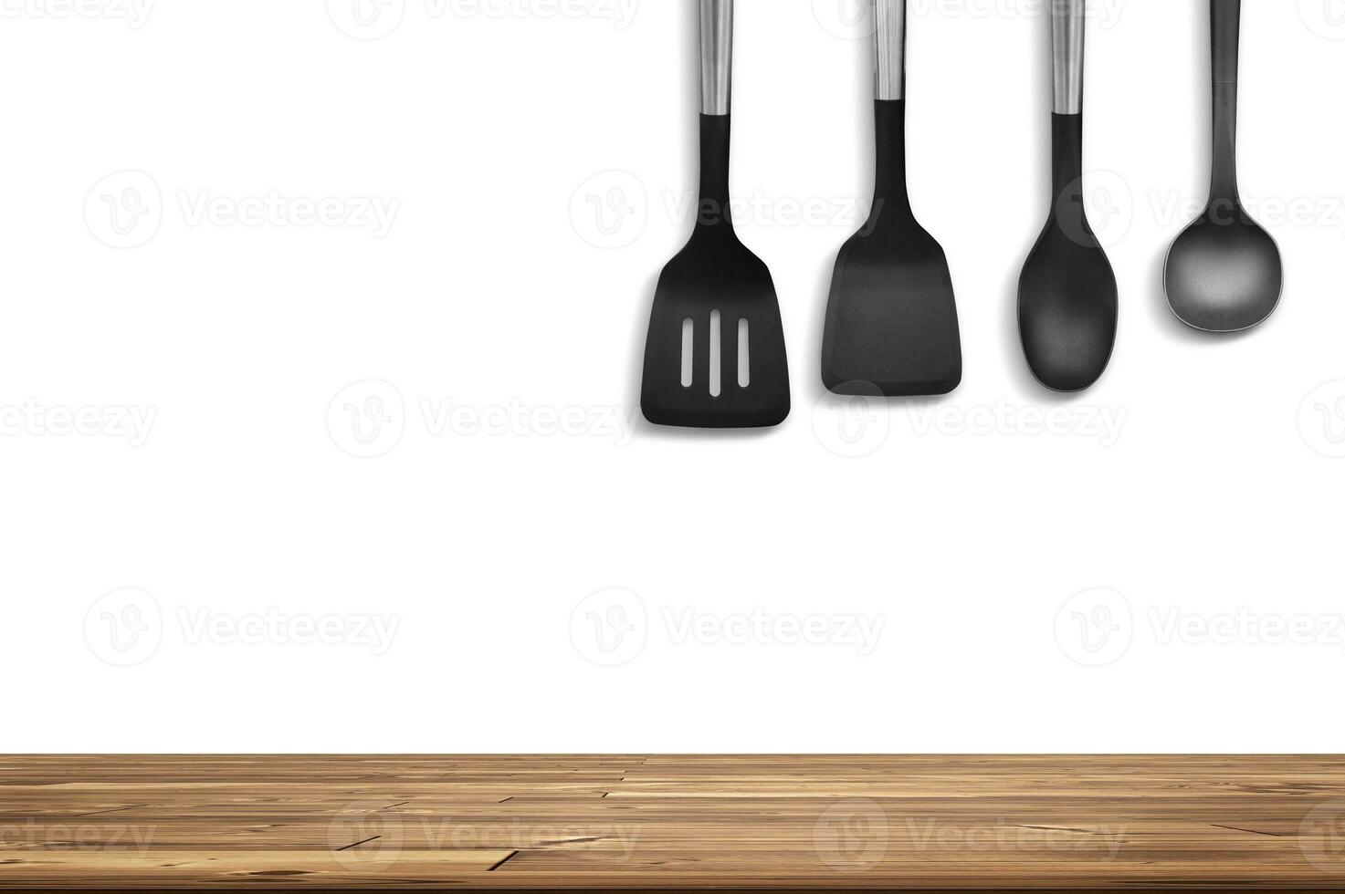 Wooden table with empty space and cooking utensils photo