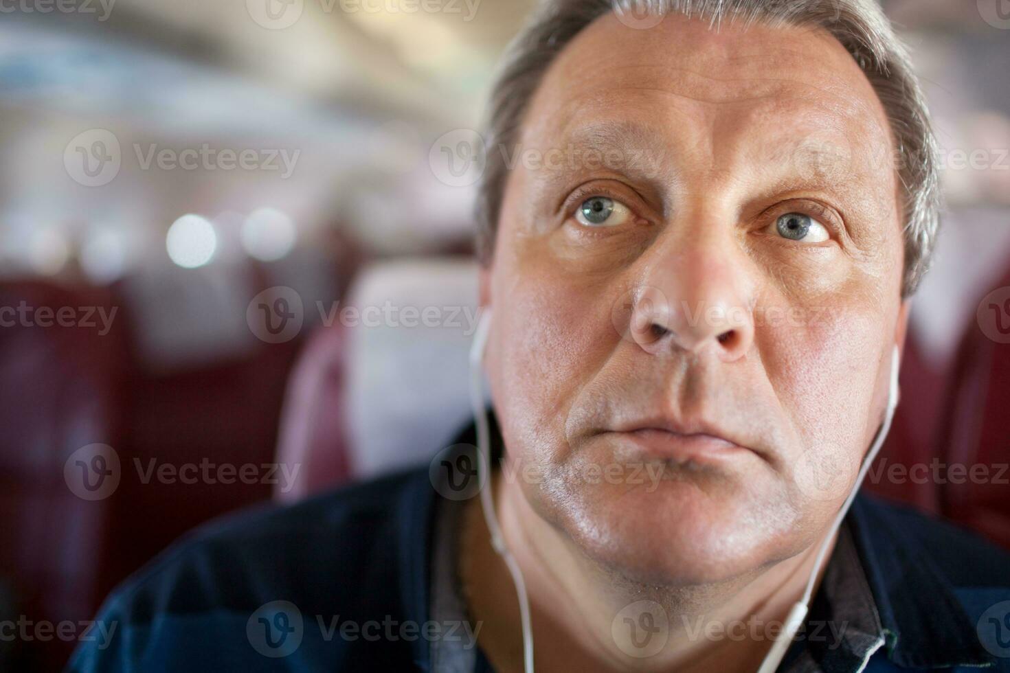 Music makes him to relax during the flight photo