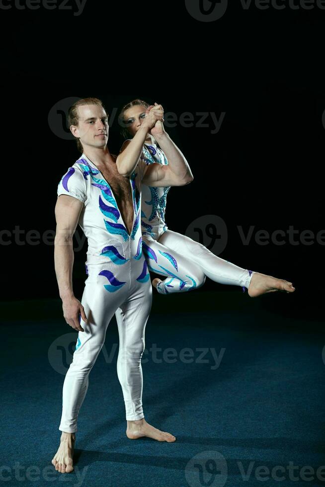 Circus artists perform different tricks. photo