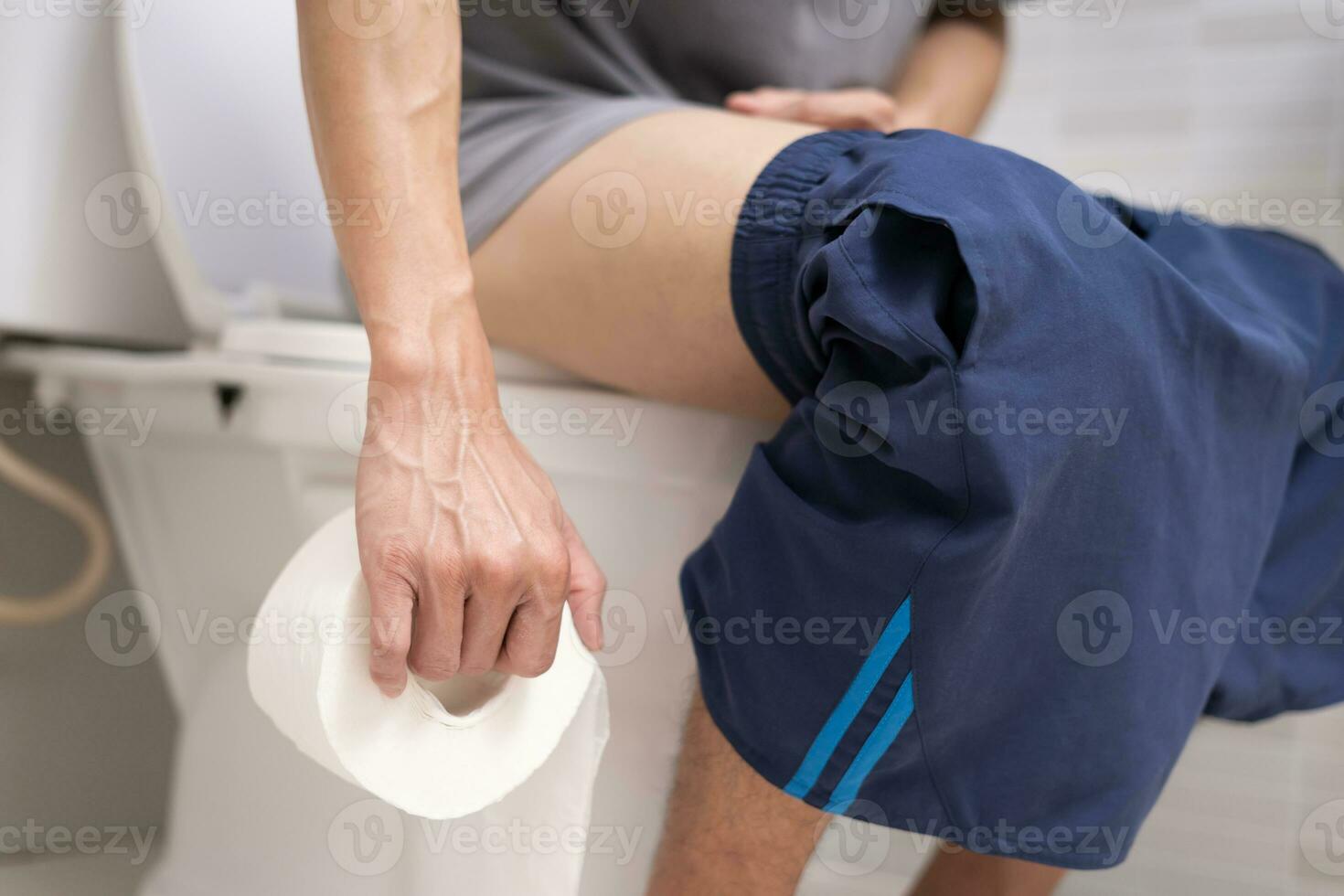 Constipation and diarrhea in bathroom. Hurt man touch belly  stomach ache painful. colon inflammation problem, toxic food, abdominal pain, abdomen, constipated in toilet, stomachache, Hygiene photo